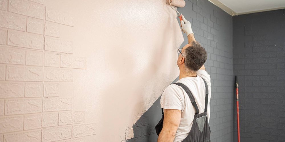 man-painting-brick-wall-with-paint-roller-2025-04-13-22-40-41-utc (2)